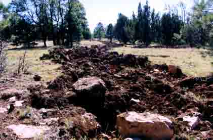 impassable ripped-up dirt road